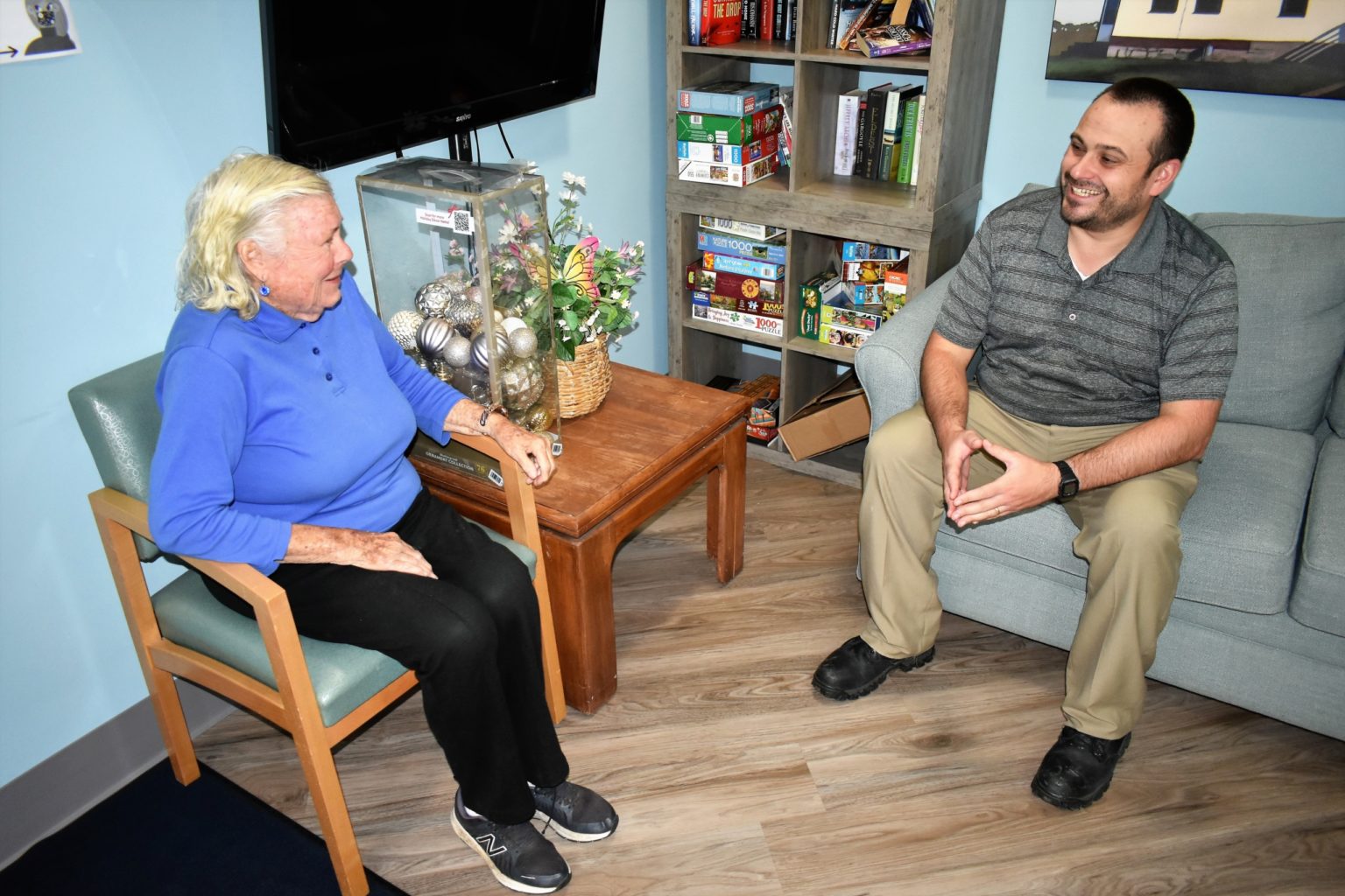 Resident visiting with property manager